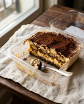 Tiramisù cross-section showing layers of espresso-soaked ladyfingers and mascarpone cream