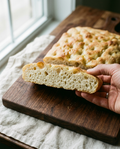 Focaccia base cut open showing its soft airy crumb