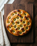 Focaccia with green pitted olives, handmade Italian focaccia